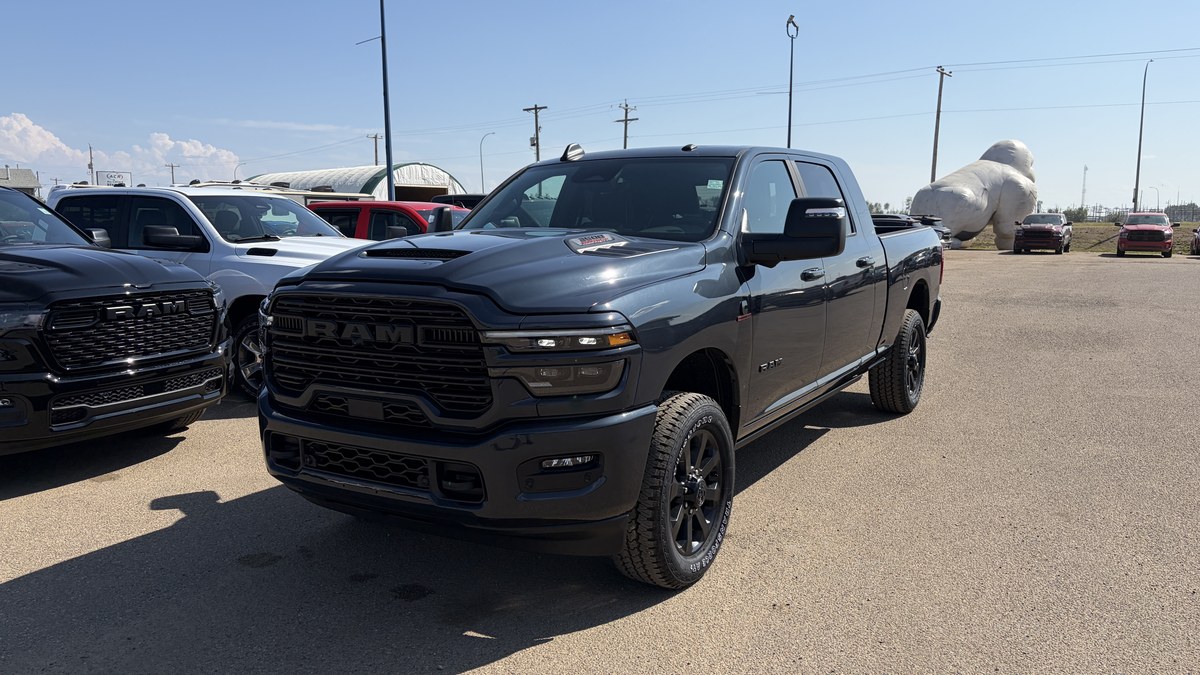 Black Ram 3500 heavy-duty pickup parked on a gravel lot